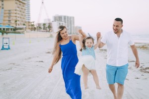 a man and a woman standing on a beach