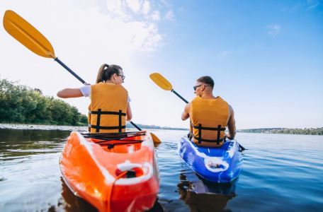 A couple enjoying adventures on a boat tour