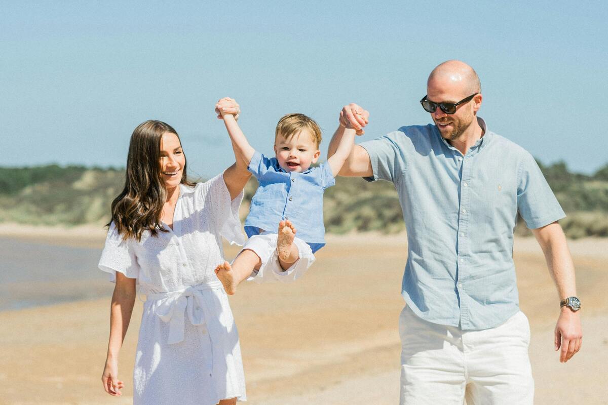 a-happy-family-along-the-beach A happy family along the beach