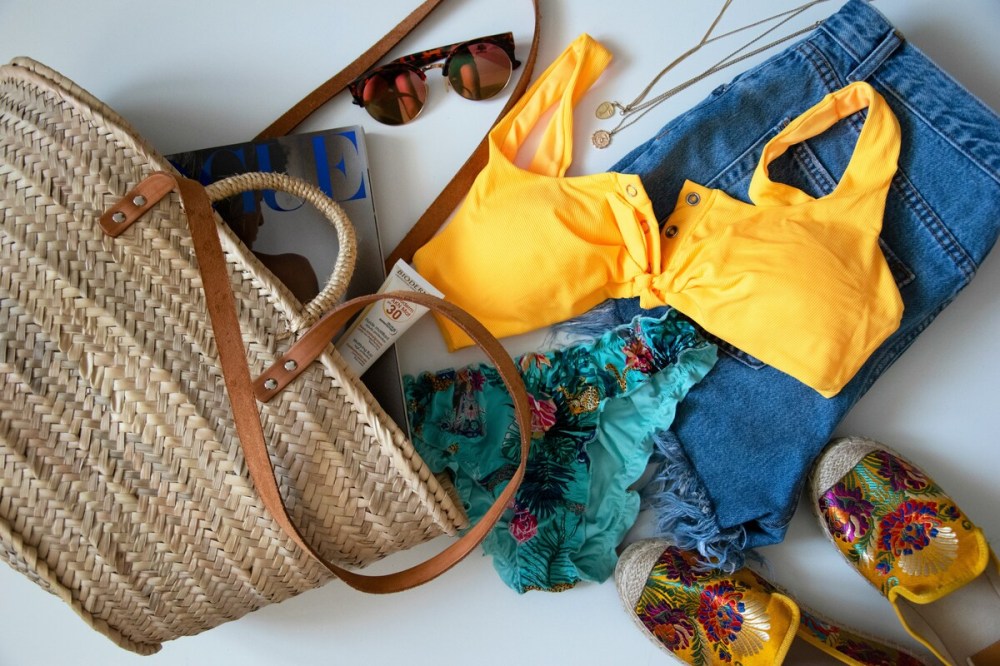 Beach outfit like clothes, sunglass, shoes and bags
