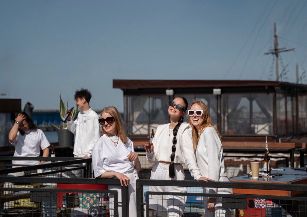 A group of young people enjoying the experience of watching a boat show 