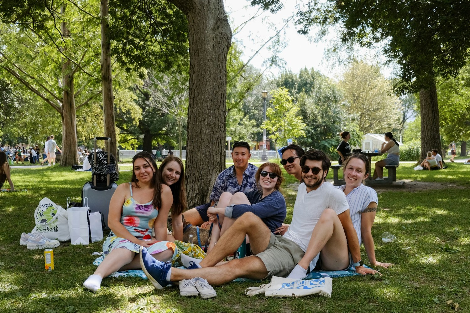 A group of people sitting in a park
