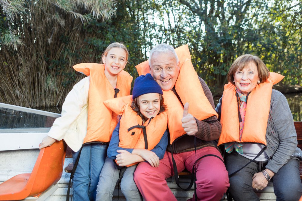 Grandparents enjoying water activities with their grandchildren 